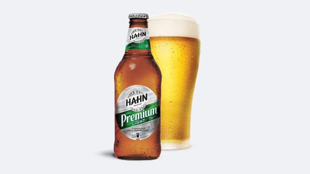 A bottle of Hahn Premium Light next to a frosty schooner